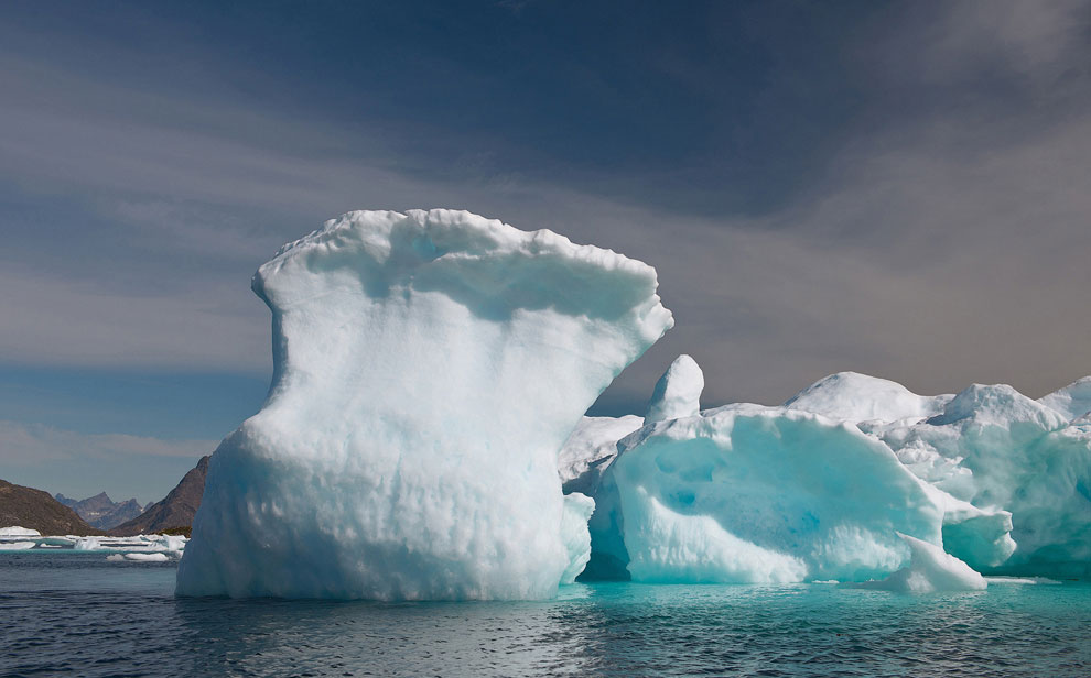 Frozen wave. Iceberg offshore Southeastern Greenland.