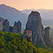 Roussanou Monastery with town of Kastraki on Thessaly valley floor at sunset. Meteora, Greece - Meteora-Monasteries-Greece - Mike Reyfman Photography
