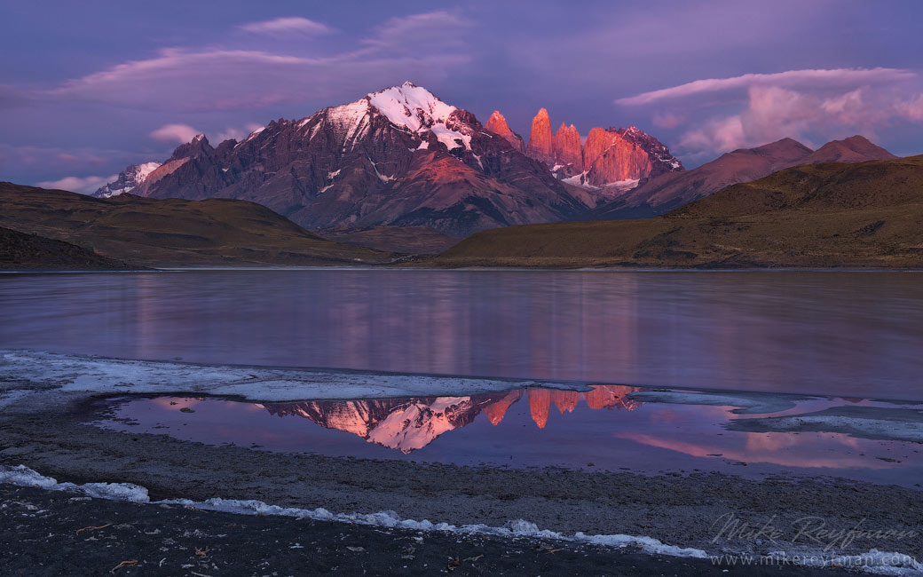 Towers of Pine reflecting in Laguna Amarga at sunrise. Torres del Paine National Park, Ultima Esperanza Province, Magallanes and Antartica Chilena Region XII, Patagonia, Chile.