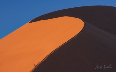 100-SV_10P7759 Hikers on the Famous Big Daddy - the Tallest Sand Dune in the Sossusvlei. Namib-Naukluft National Park, Namibia.