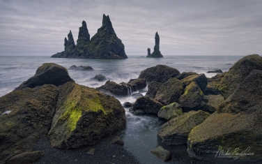 011-IC-CL_M3X3733 Iconic Reynisdrangar basalt sea stacks. Reynisfjara black volcanic sand beach, Vík í Mýrdal, Southern Iceland.