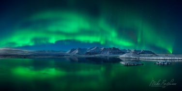 IC-ICE 004 _D1E4218-24_Pano-1x2 Aurora Borealis (Northern Lights) reflecting in Jokulsarlon (Jökulsárlón) glacial lagoon. Breiðamerkurjökull glacier, Vatnajökull National Park, Iceland, South coast