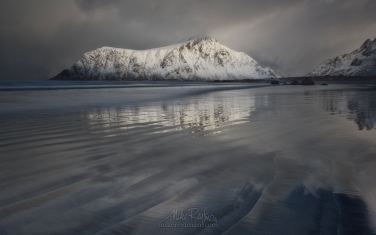 LF-MRD1E1075 Afternoon at Skagsanden beach surrounded by snow covered mountains reflected in the cold sea, Flakstad, Lofoten Islands, Arctic, Norway, Scandinavia, Europe