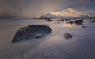 LF-MRD1E1141 Afternoon at Skagsanden beach surrounded by snow covered mountains reflected in the cold sea, Flakstad, Lofoten Islands, Arctic, Norway, Scandinavia, Europe