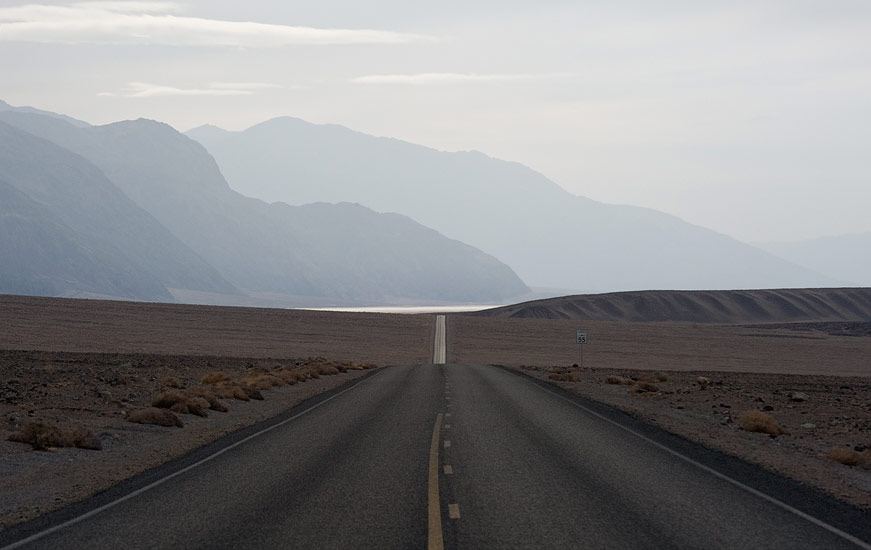  Badwater Road under hazy skies. Death Valley National Park, California, USA.