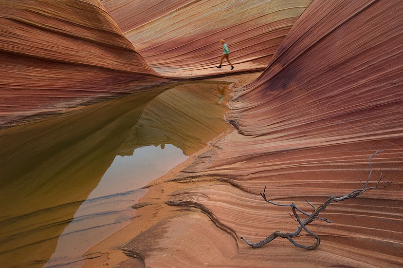 Little Orange Gnome. Woman walking in the Main Corridor of The Wave. - The-Wave-NorthCoyoteButtes-PariaCanyo-VermilionCliffs-Arisona - Mike Reyfman Photography