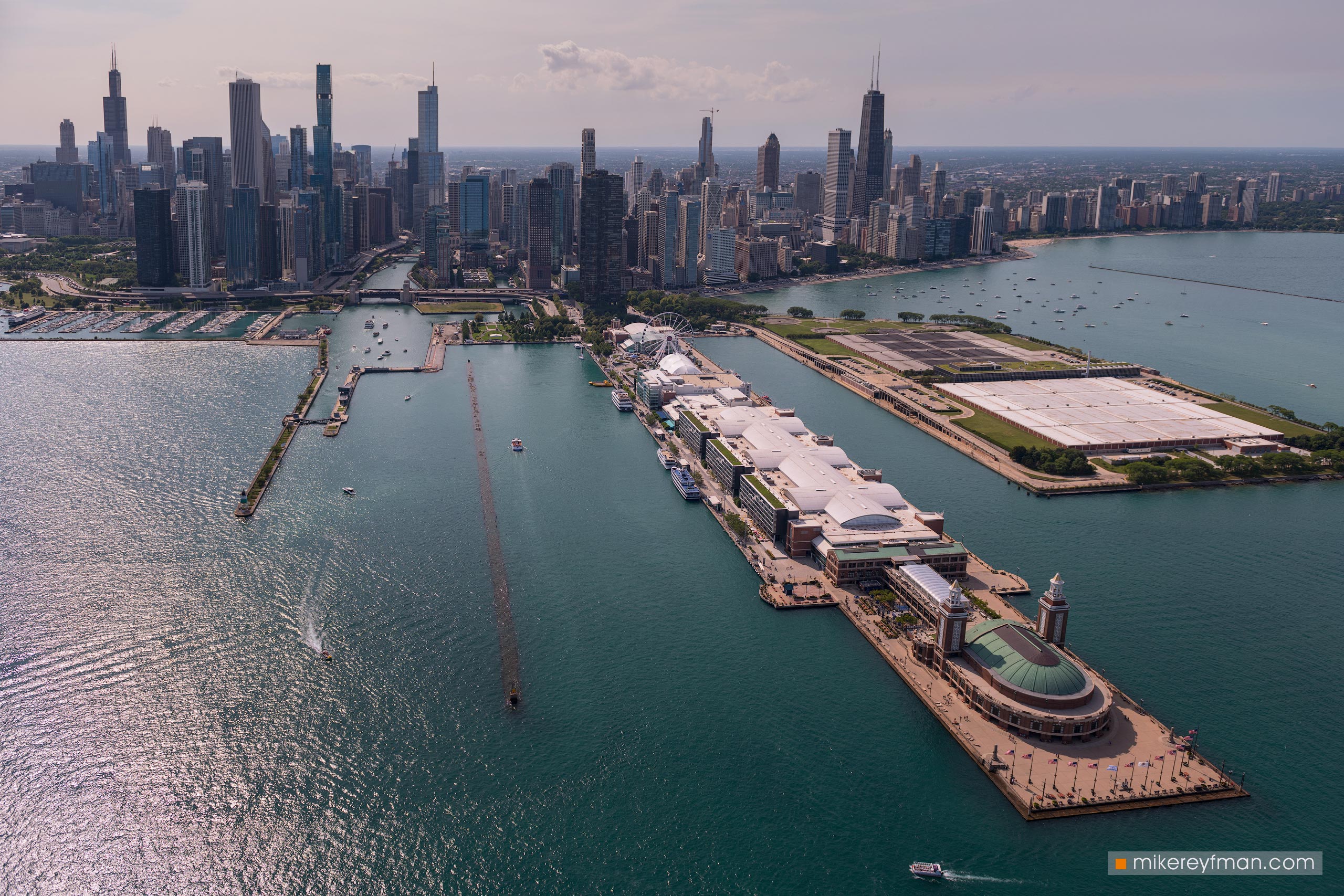 Aerial view of Chicago Skyline with Chicago Harbor and Navy Pier in the foreground. Chicago, Illinois, USA. 054-CH-2_50F1807 - Ever-beating architectural heart of America. The birthplace of the most iconic buildings in the country. - Mike Reyfman Photography