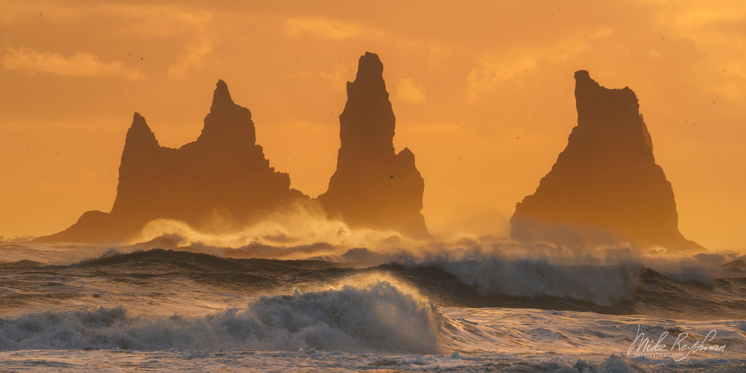 Reynisdrangar basalt sea stacks with breaking waves on the foreground.  Reynisfjara, Vík í Mýrdal, Southern Iceland. 005-IC-CL_D1E3271 - Where Lava Meets the Ocean. Iceland coastline. - Mike Reyfman Photography