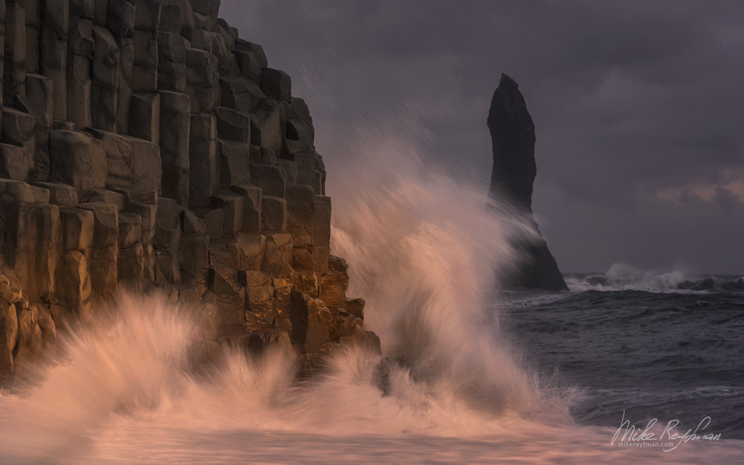 Breaking waves hitting Mt. Reynisfjall and Reynisdrangar basalt sea stacks at Reynisfjara black sand beach. Southern Iceland. 014-IC-CL_D1E3481 - Where Lava Meets the Ocean. Iceland coastline. - Mike Reyfman Photography