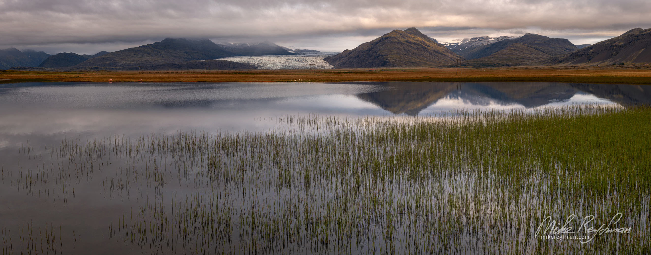 A distant view of the mountains along the Ring Road. Southeast Iceland. 050-IC-GP _50B0014_Pano-1x2.55 - Rhyolite Mountains, Crater Lakes, Geothermal Areas, Lava Fields and Glacial Rivers. Iceland.  - Mike Reyfman Photography