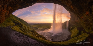 Seljalandsfoss-waterfall-bathed-in-the-light-of-the-midnight-sun.-Iceland,-South-Coast,-Route-1.