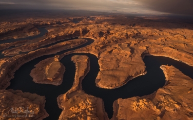 Sunset-on-Planet-Earth.-Confluence-of-San-Juan-&-Colorado-Rivers.-Glen-Canyon-NRA,-Lake-Powell,-Utah/Arizona,-USA.-Aerial.