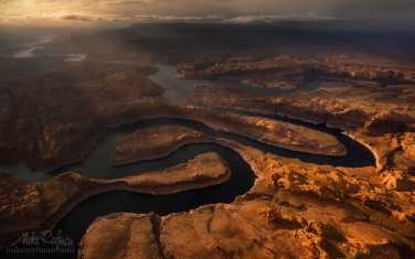 Sunset-on-Planet-Earth.-Confluence-of-San-Juan-&-Colorado-Rivers.-Glen-Canyon-NRA,-Lake-Powell,-Utah/Arizona,-USA.-Aerial.