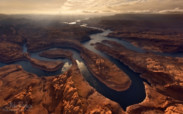 Sunset-on-Planet-Earth.-Confluence-of-San-Juan-&-Colorado-Rivers.-Glen-Canyon-NRA,-Lake-Powell,-Utah/Arizona,-USA.-Aerial.