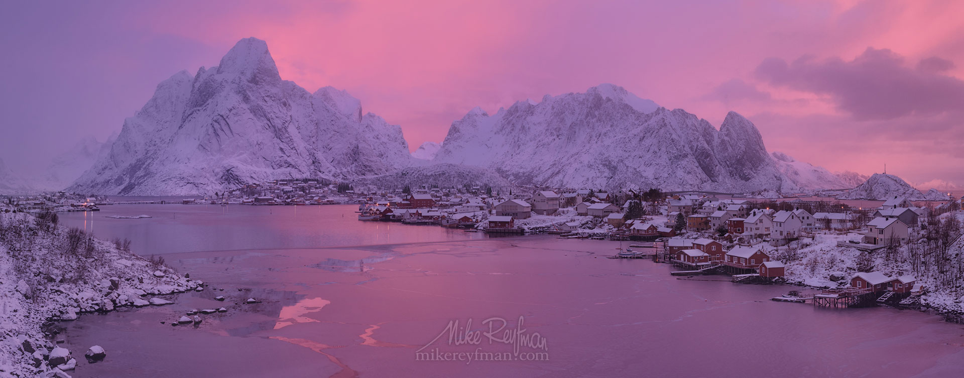 Arctic Morning. Panoramic view of Olstinden mountain peak and fishing village of Reine at sunrise. Moskenes, Lofoten archipelago, Norway. LF-MRD1E0840-46_Pano-2.55x1 - Lofoten Archipelago in Winter, Arctic Norway - Mike Reyfman Photography