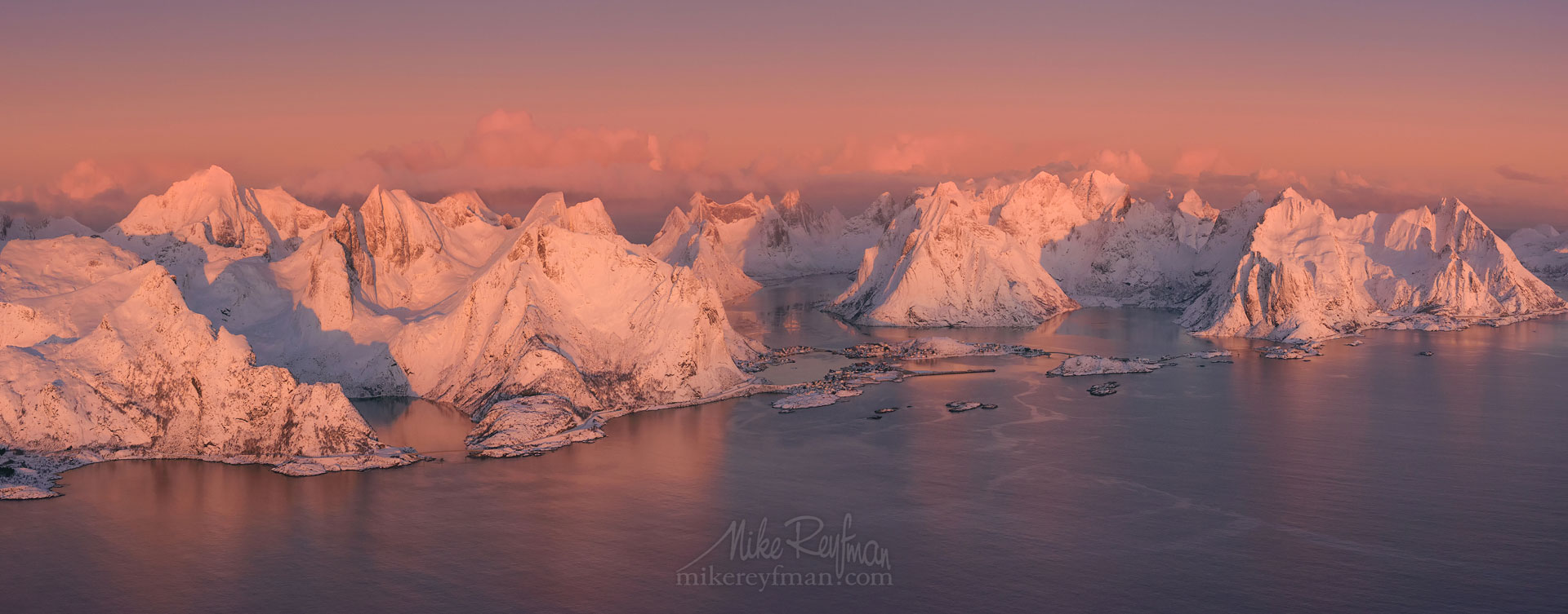 Aerial panoramic view of Lofoten archipelago and fishing village of Reine at sunrise. Moskenes, Lofoten archipelago, Norway. LF-MRD1E1373-5-6_Pano-2.55x1 - Lofoten Archipelago in Winter, Arctic Norway - Mike Reyfman Photography