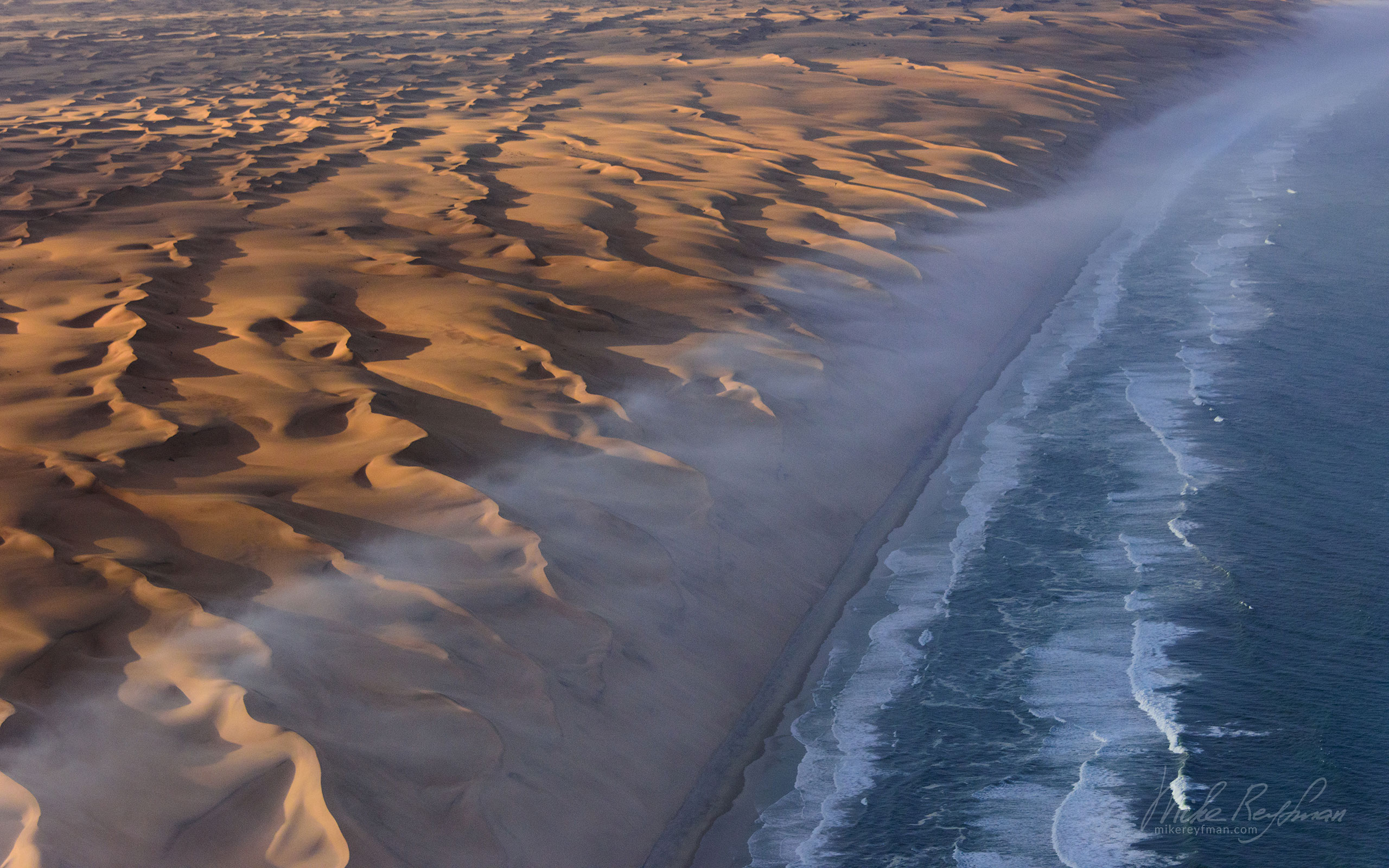 Where two oceans meet. Atlantic Ocean and sand dunes of the Skeleton Coast. Namib Skeleton Coast National Park, Namibia SCW_012_10P8357 - Shipwrecks and Endless Dunes of Namib Skeleton Coast NP, Dense ocean fogs of the Benguela Current, Cape Fur seals, and Walvis Bay Salt Works. Namibia.  - Mike Reyfman Photography