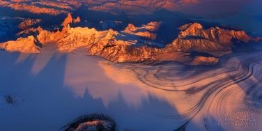 Granite-spires-of-Cerro-Torre-massif-and-mount-Fitzroy-erupted-through-the-Southern-Patagonia-ice-cap.-Viedma-Glacier-on-the-foreground.-Panoramic-1:2