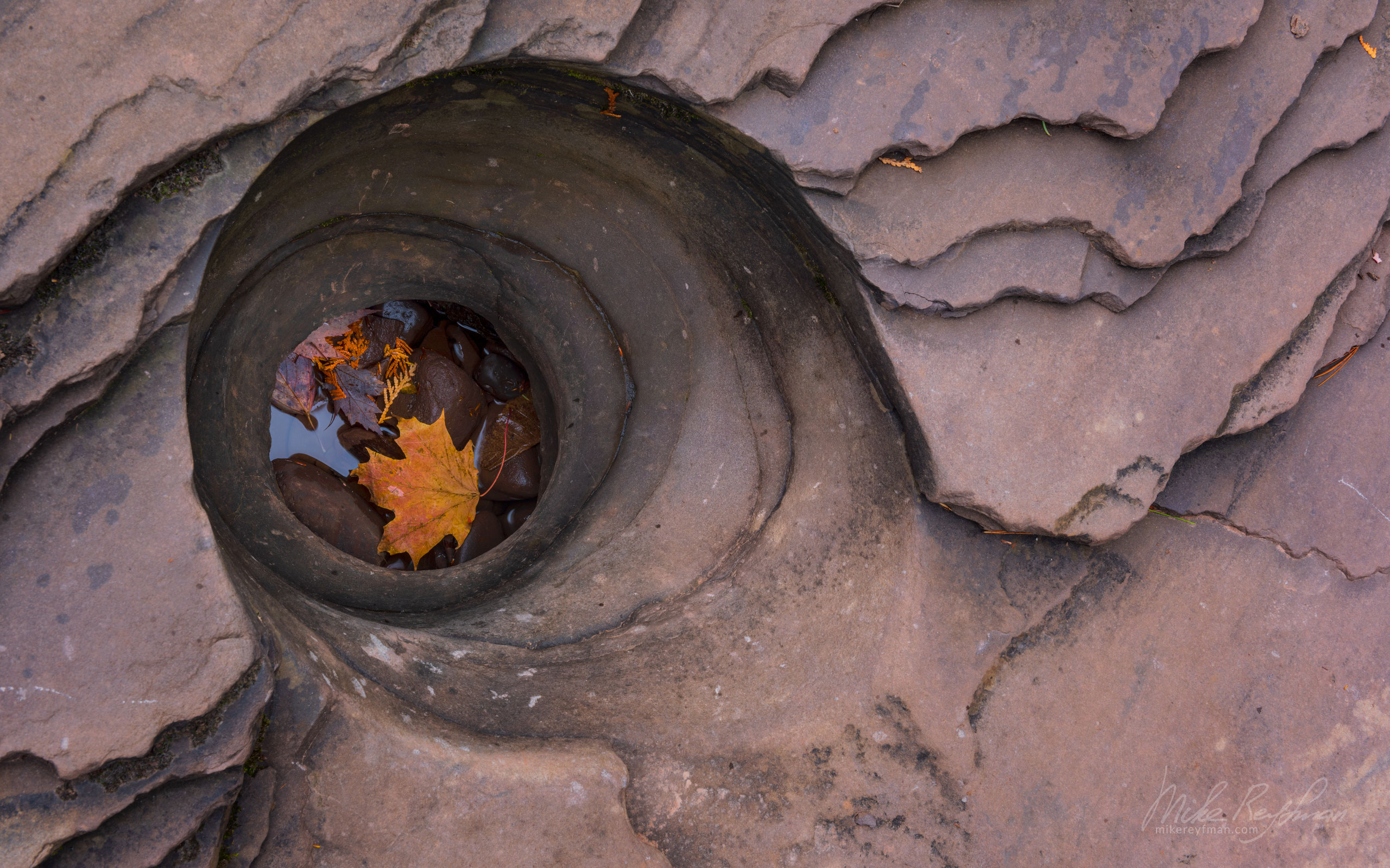 Pebbles and fall leaves in the bedrock pothole of Presque Isle River. Porcupine Mountains, Upper Peninsula, Michigan, USA. UP-MI_051_ZRA8009.jpg - Michigan's Upper Peninsula - the best destination in US for fall colors. - Mike Reyfman Photography