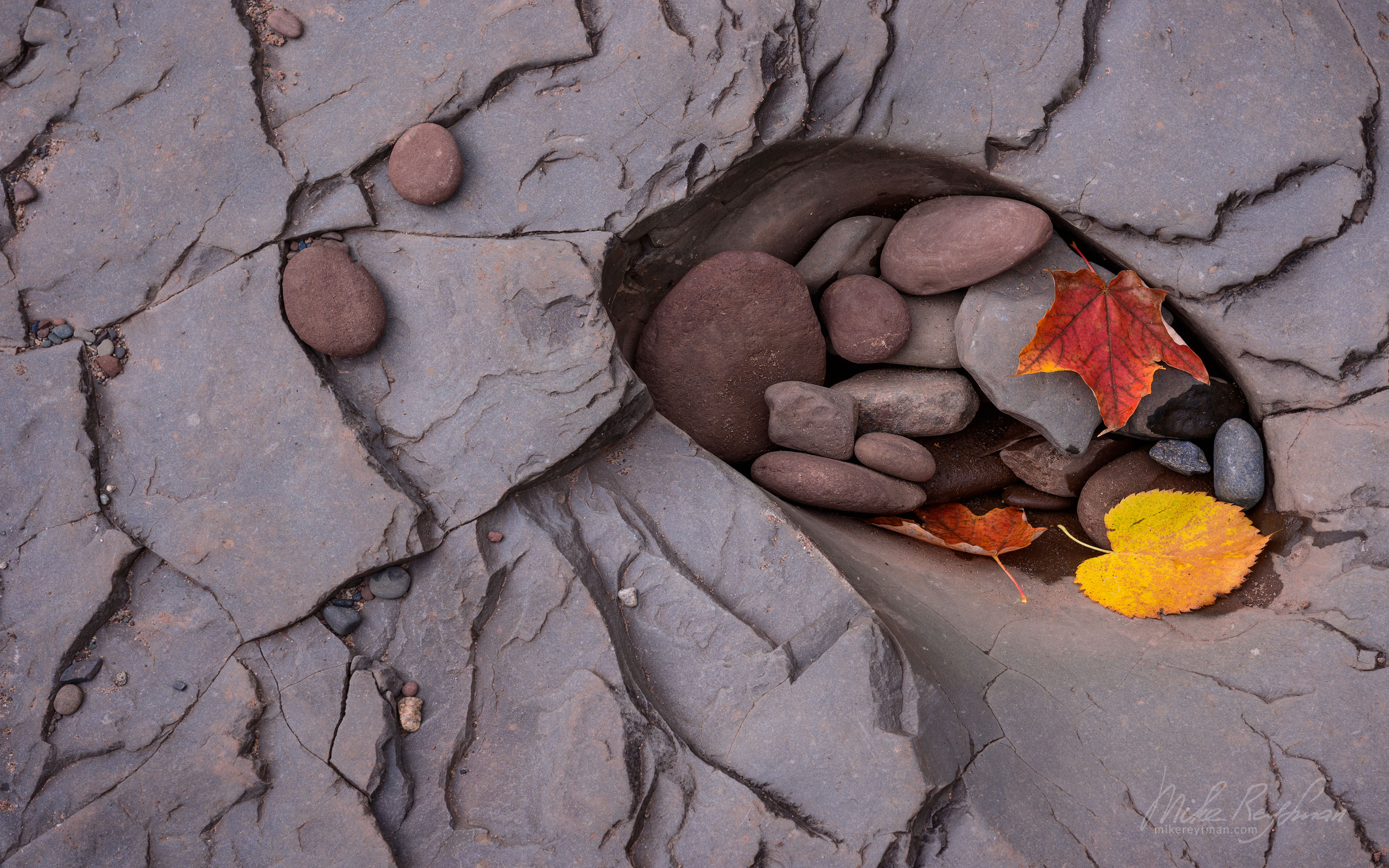 Pebbles and fall leaves in the bedrock pothole of Big Iron River at Bonanza Falls. Porcupine Mountains, Upper Peninsula, Michigan, USA. UP-MI_052_ZRA6962.jpg - Michigan's Upper Peninsula - the best destination in US for fall colors. - Mike Reyfman Photography